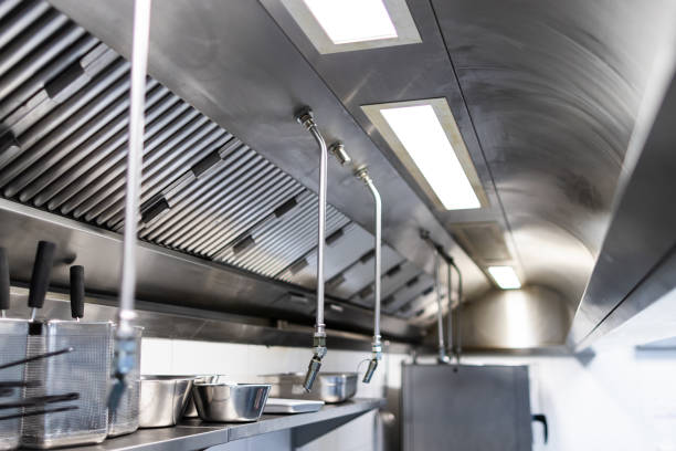 Commercial kitchen hood being cleaned